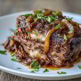 Topped with gooey melted Gruyère and fresh parsley, this French-American slow cooker dinner is pure comfort.