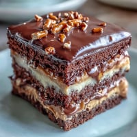 Decadent Father's Day Chocolate Peanut Butter Pretzel Cake with rich layers and salty crunch.